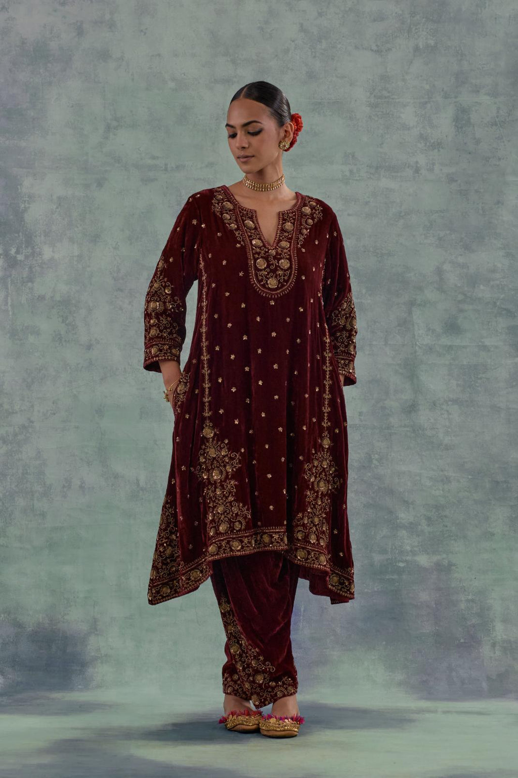 Deep maroon easy fit A-line, panelled, short kurta set in silk velvet with all-over hand embroidery at the neck, sleeves and hem.