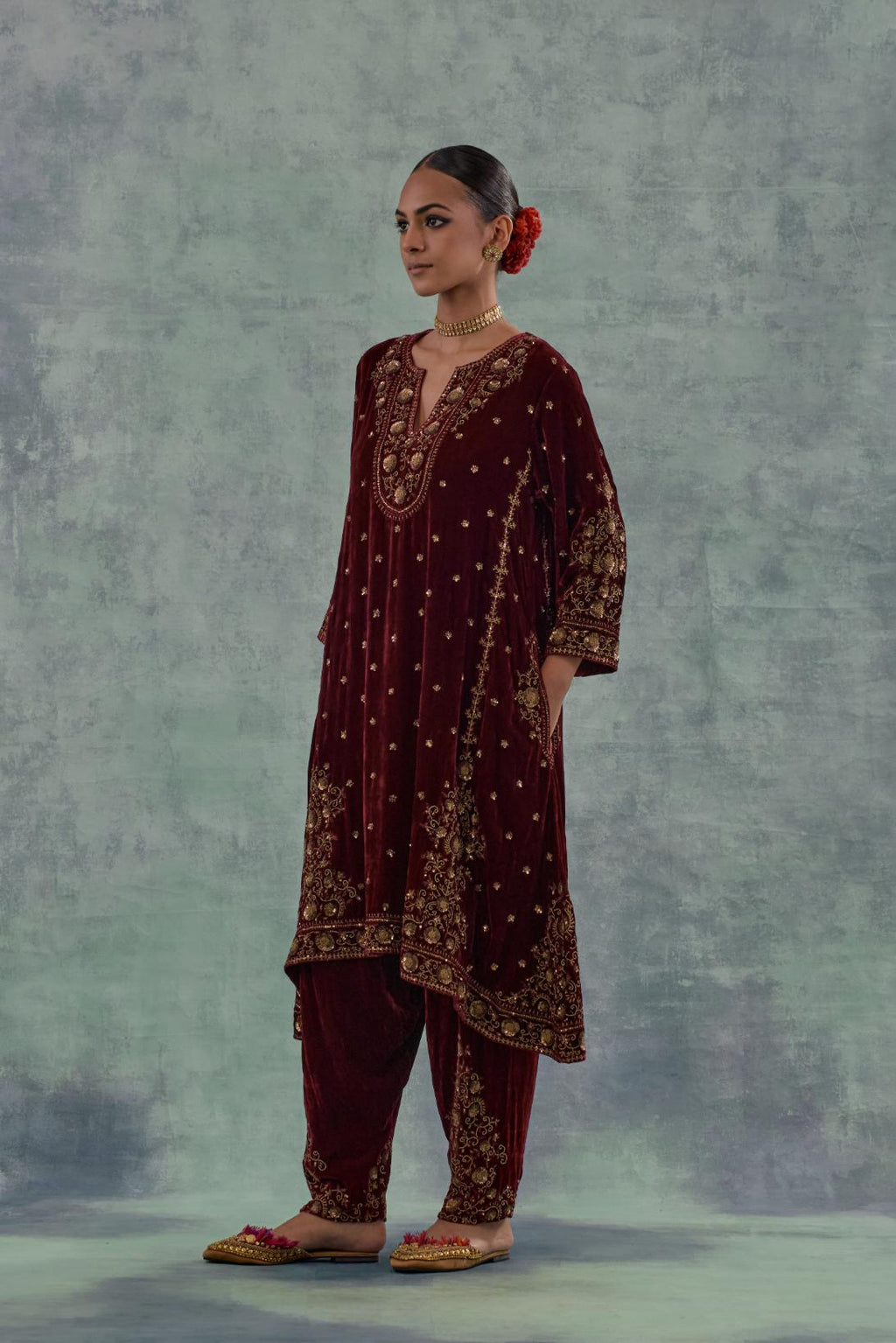 Deep maroon easy fit A-line, panelled, short kurta in silk velvet with all-over hand embroidery at the neck, sleeves and hem.