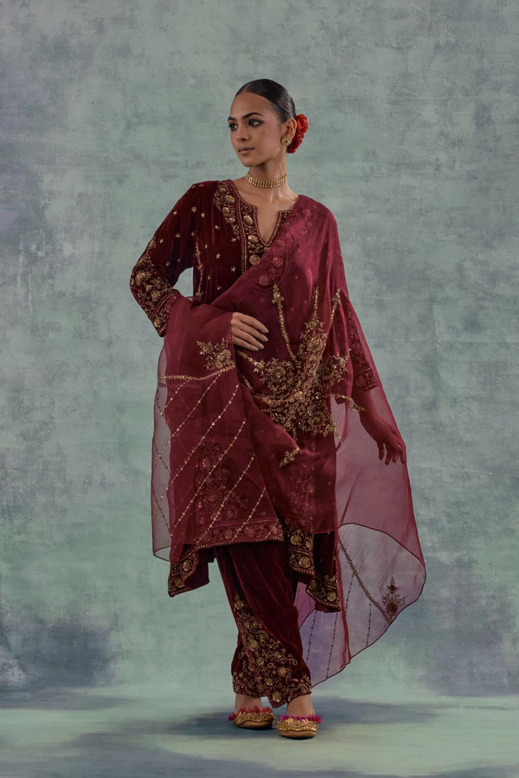 Deep maroon easy fit A-line, panelled, short kurta set in silk velvet with all-over hand embroidery at the neck, sleeves and hem.