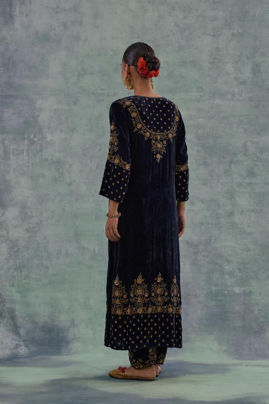 Navy straight long kurta Set in Silk Velvet with hand-embroidered bead, sequins and zari detailing on neck, sleeves and hem.