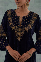 Navy straight long kurta Set in Silk Velvet with hand-embroidered bead, sequins and zari detailing on neck, sleeves and hem.