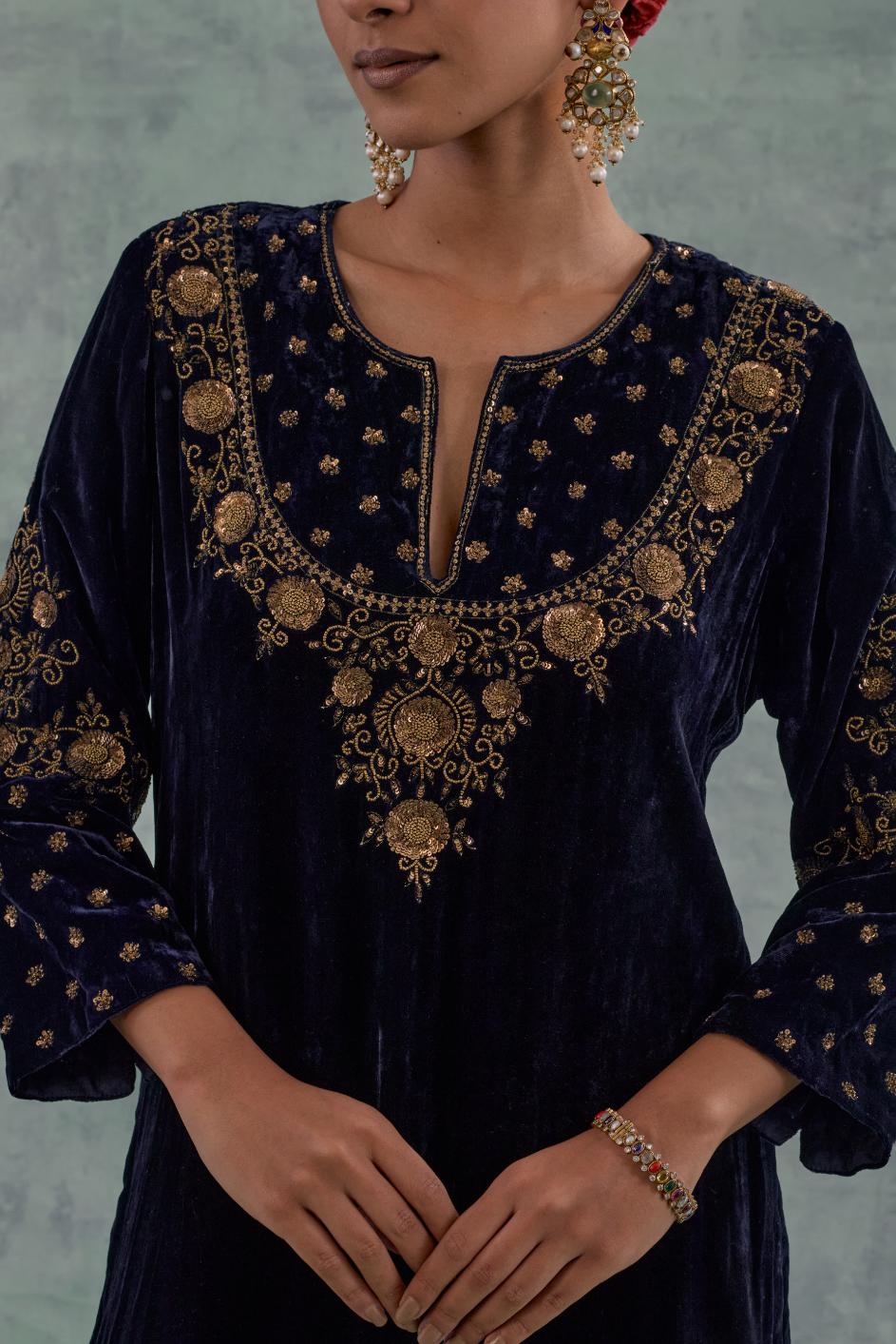 Navy straight long kurta Set in Silk Velvet with hand-embroidered bead, sequins and zari detailing on neck, sleeves and hem.