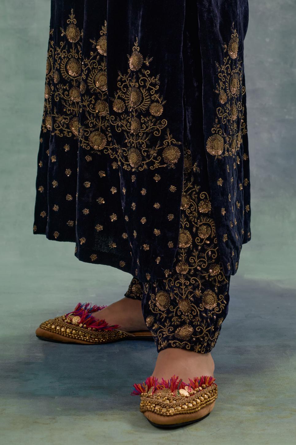 Navy straight long kurta Set in Silk Velvet with hand-embroidered bead, sequins and zari detailing on neck, sleeves and hem.