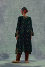 Emerald green easy fit A-line short kurta set in silk velvet with all-over bead, sequins and zari hand embroidery.