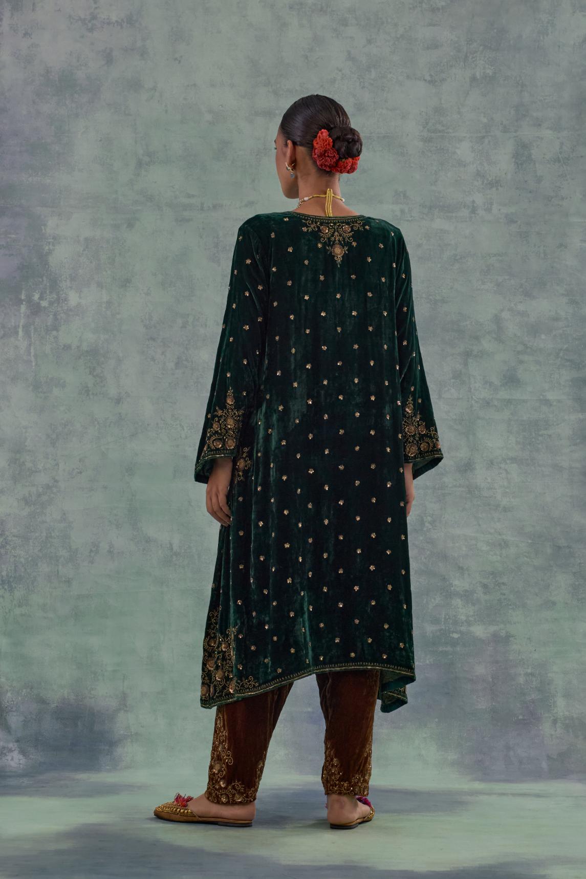 Emerald green easy fit A-line short kurta set in silk velvet with all-over bead, sequins and zari hand embroidery.