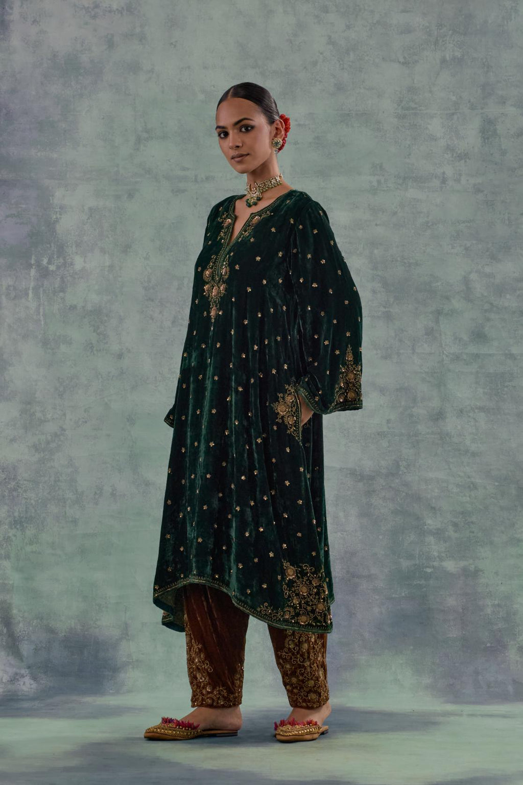 Emerald green easy fit A-line short kurta set in silk velvet with all-over bead, sequins and zari hand embroidery.