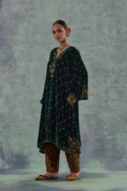 Emerald green easy fit A-line short kurta set in silk velvet with all-over bead, sequins and zari hand embroidery.