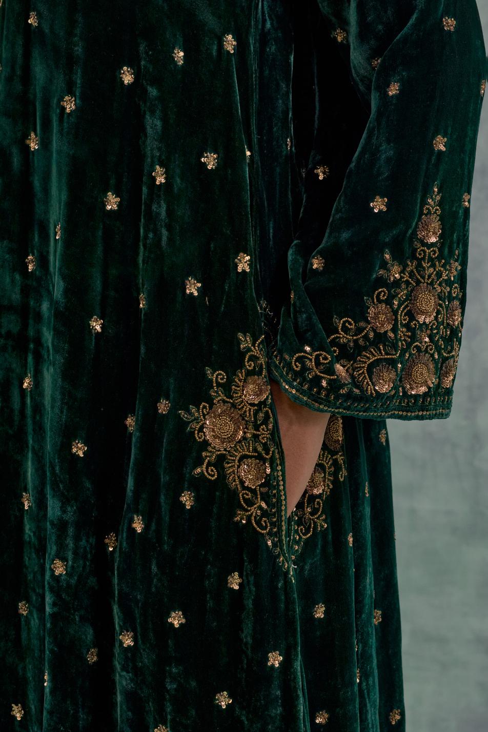 Emerald green easy fit A-line short kurta set in silk velvet with all-over bead, sequins and zari hand embroidery.