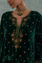 Emerald green easy fit A-line short kurta set in silk velvet with all-over bead, sequins and zari hand embroidery.