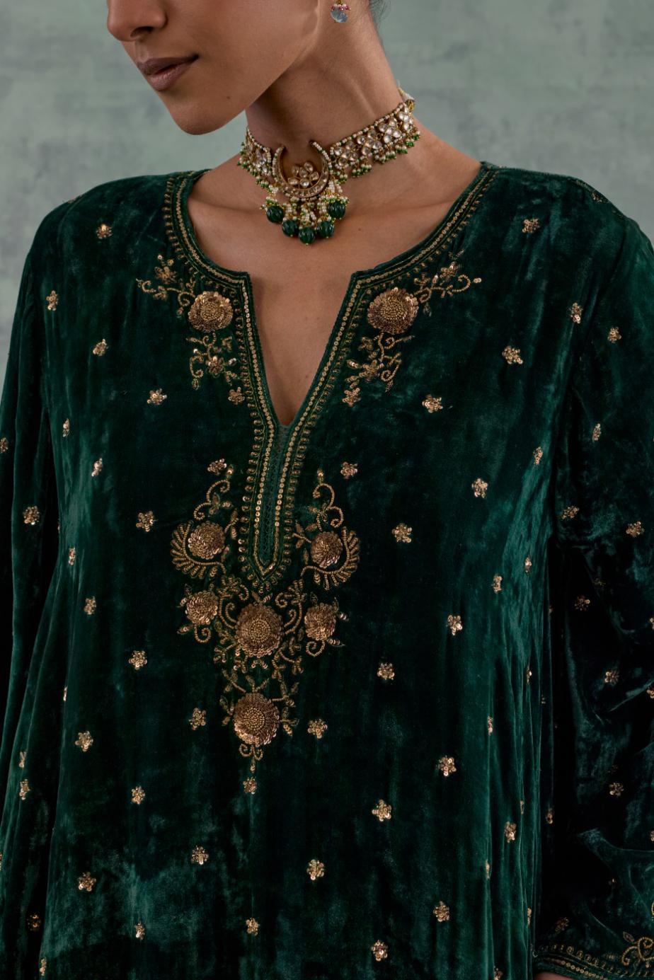 Emerald green easy fit A-line short kurta set in silk velvet with all-over bead, sequins and zari hand embroidery.
