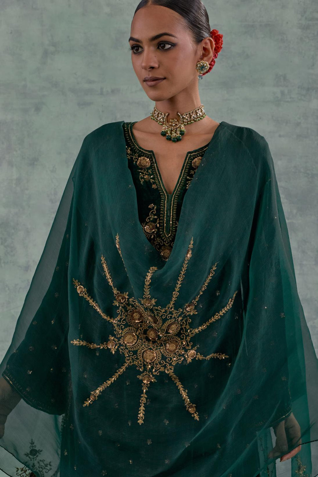 Emerald green easy fit A-line short kurta set in silk velvet with all-over bead, sequins and zari hand embroidery.