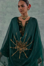 Emerald green easy fit A-line short kurta set in silk velvet with all-over bead, sequins and zari hand embroidery.
