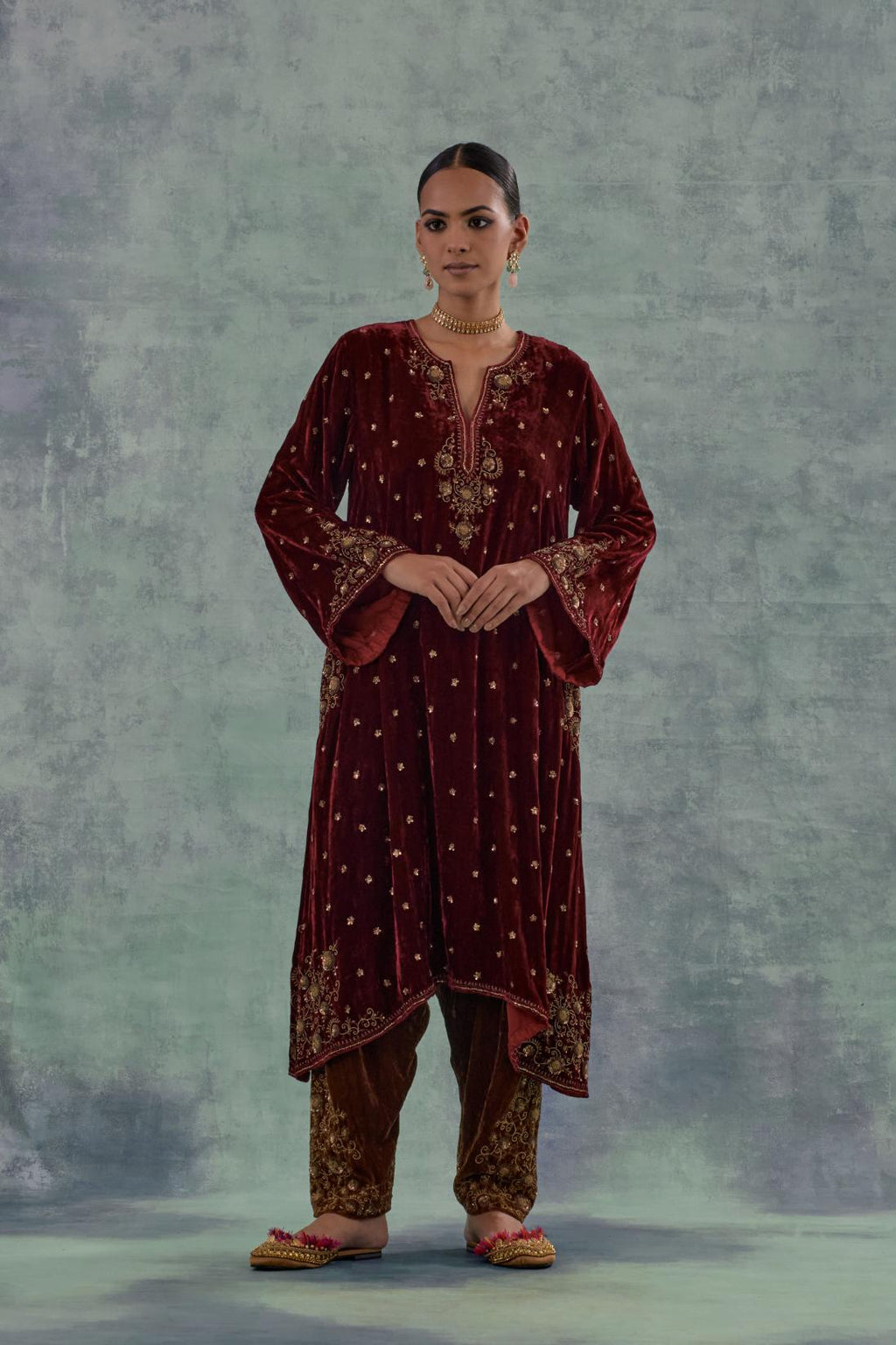 Deep maroon easy fit A-line short kurta set in silk velvet with all-over bead, sequins and zari hand embroidery.