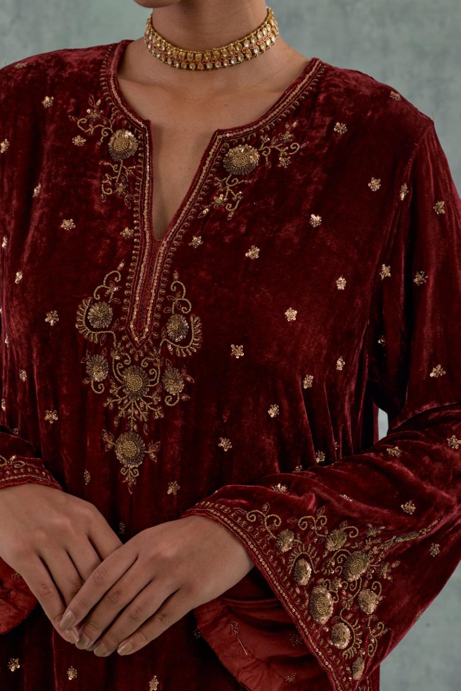 Deep maroon easy fit A-line short kurta set in silk velvet with all-over bead, sequins and zari hand embroidery.
