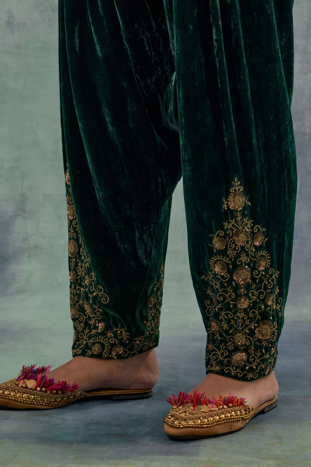 Emerald Green Silk velvet salwar, highlighted with hand embroidered bead, sequins and zari motifs.