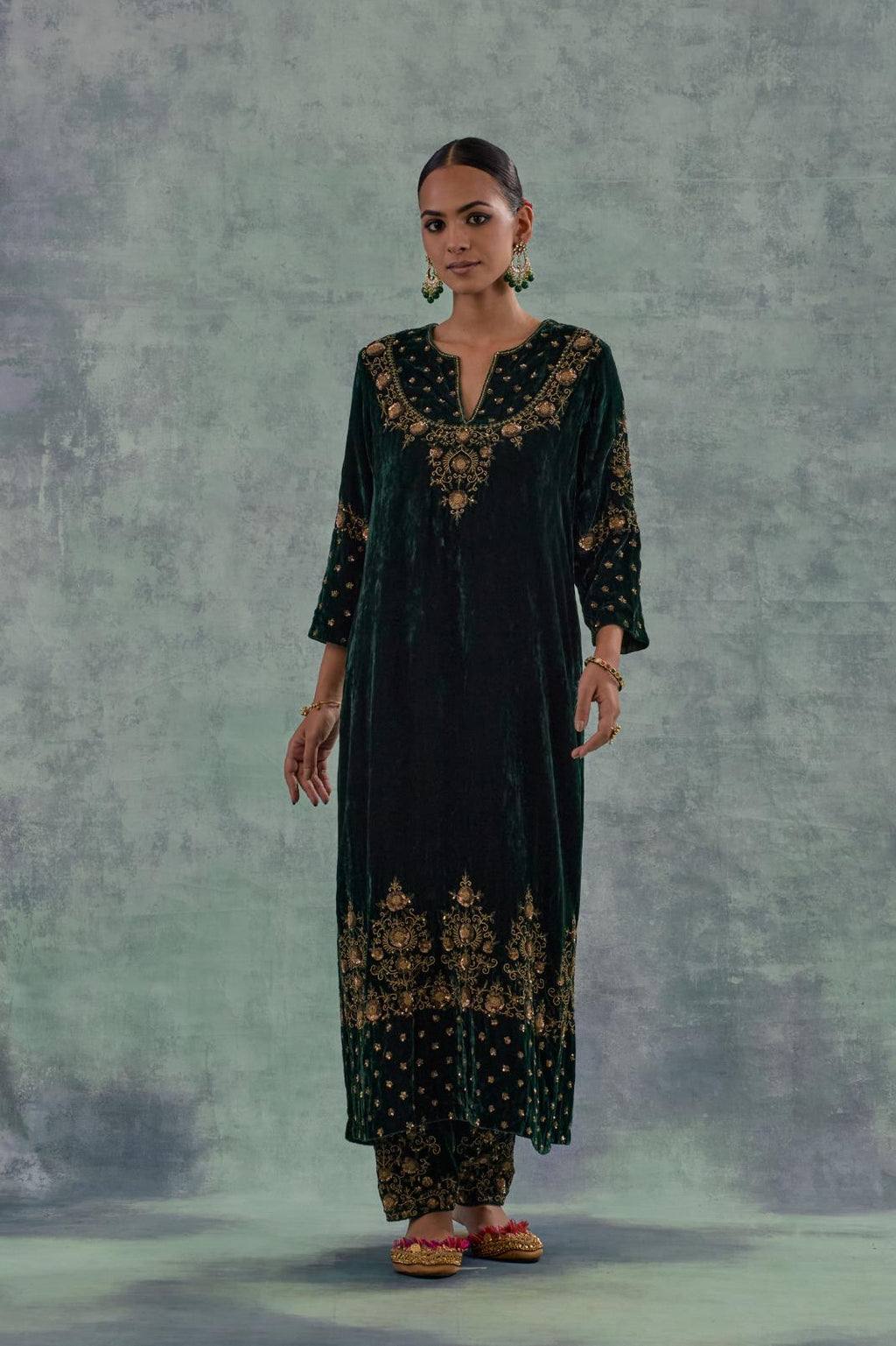 Emerald Green straight long kurta Set in Silk Velvet with hand-embroidered bead, sequins and zari detailing on neck, sleeves and hem.