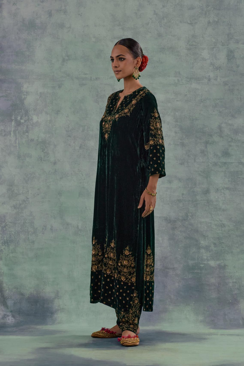 Emerald Green straight long kurta Set in Silk Velvet with hand-embroidered bead, sequins and zari detailing on neck, sleeves and hem.