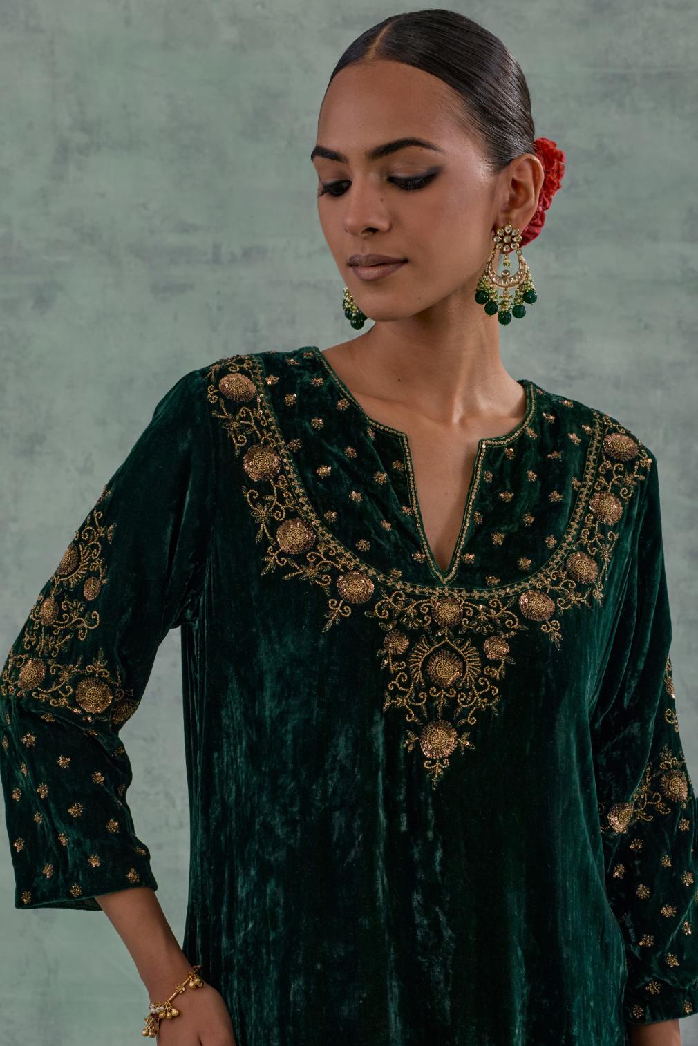 Emerald Green straight long kurta Set in Silk Velvet with hand-embroidered bead, sequins and zari detailing on neck, sleeves and hem.