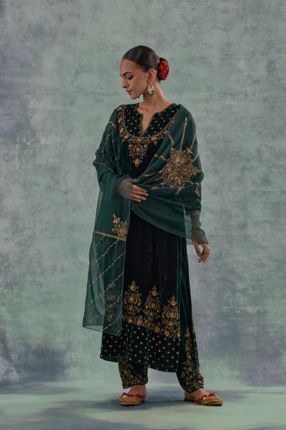 Emerald Green straight long kurta Set in Silk Velvet with hand-embroidered bead, sequins and zari detailing on neck, sleeves and hem.