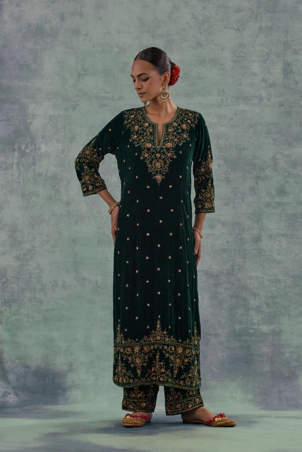 Emerald Green straight long kurta Set in Silk Velvet with hand-embroidered bead, sequins and zari detailing on neck, sleeves and hem.