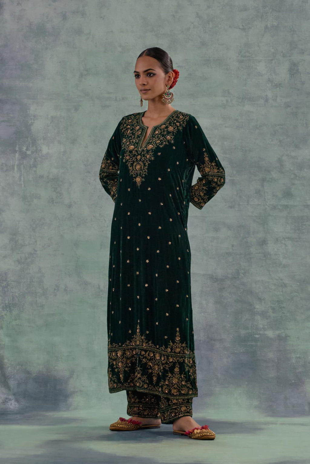 Emerald Green straight long kurta Set in Silk Velvet with hand-embroidered bead, sequins and zari detailing on neck, sleeves and hem.