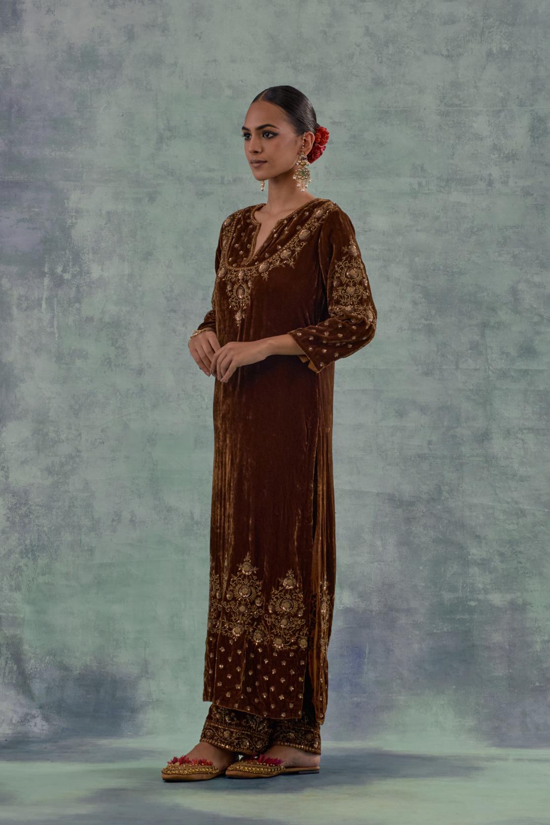 Russet straight long kurta set in Silk Velvet with hand-embroidered bead, sequins and zari detailing on neck, sleeves and hem.