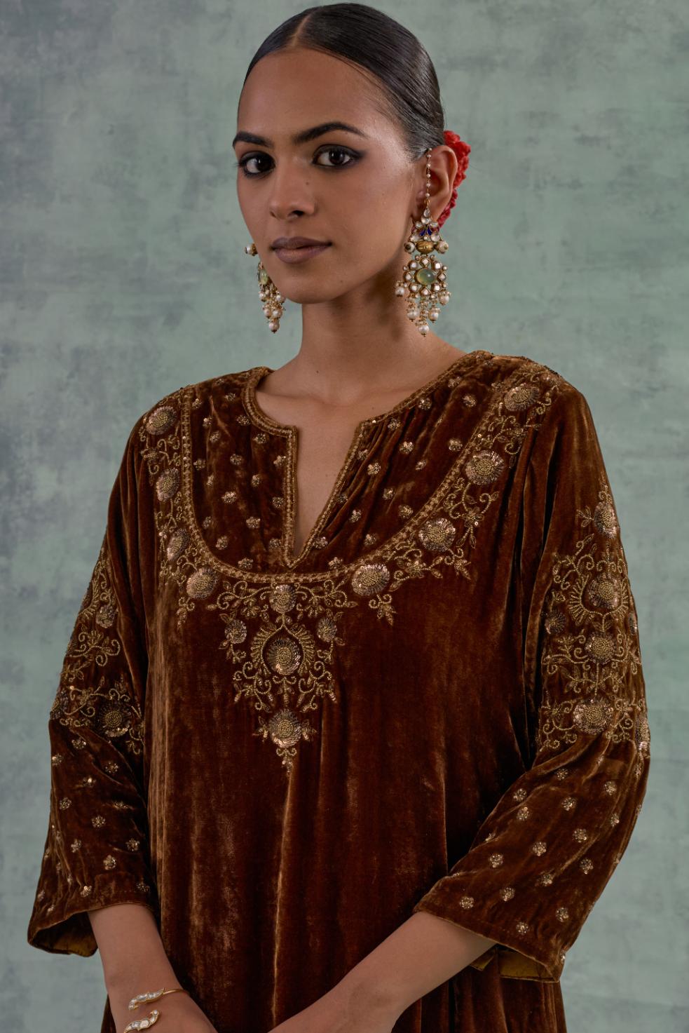 Russet straight long kurta set in Silk Velvet with hand-embroidered bead, sequins and zari detailing on neck, sleeves and hem.