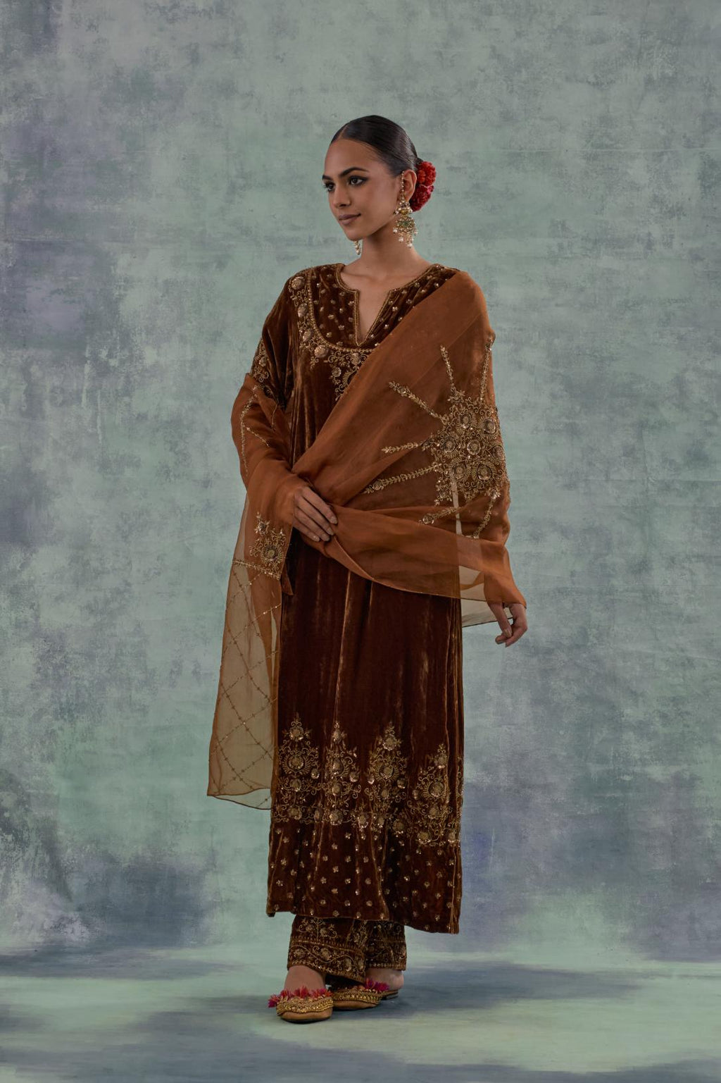 Deep maroon straight long kurta set in Silk Velvet with hand-embroidered bead, sequins and zari detailing on neck, sleeves and hem.