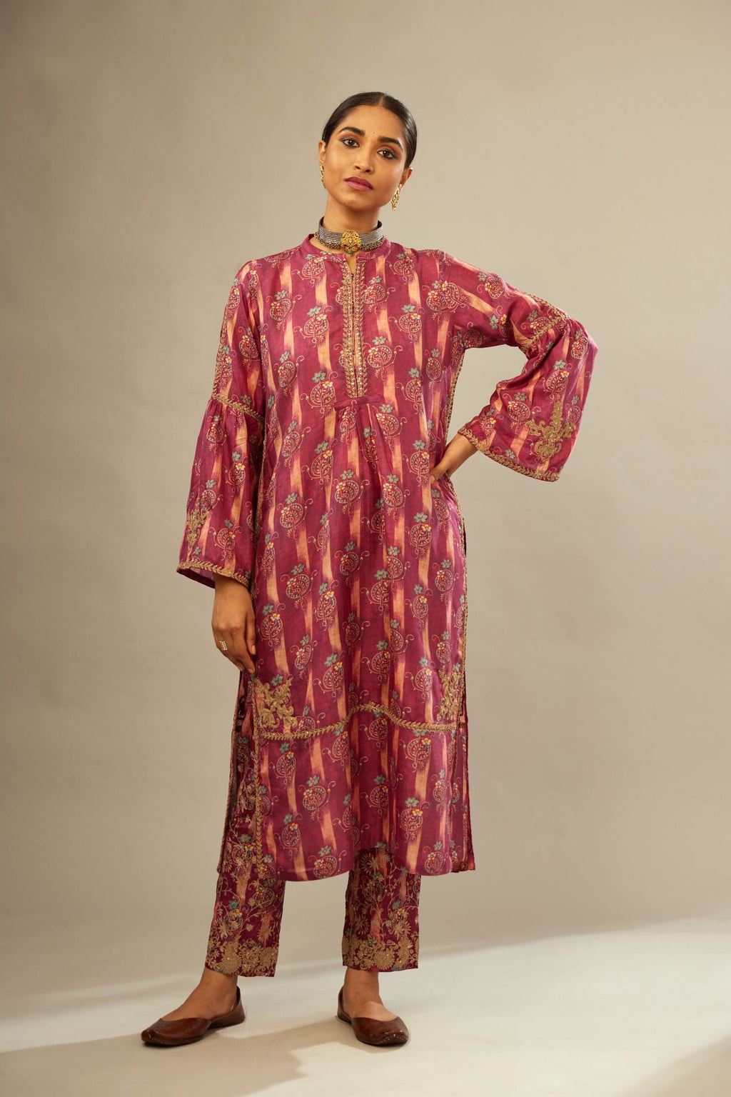 Deep wine orange digital printed dori embroidered silk kurta set, highlighted with gold sequin handwork.