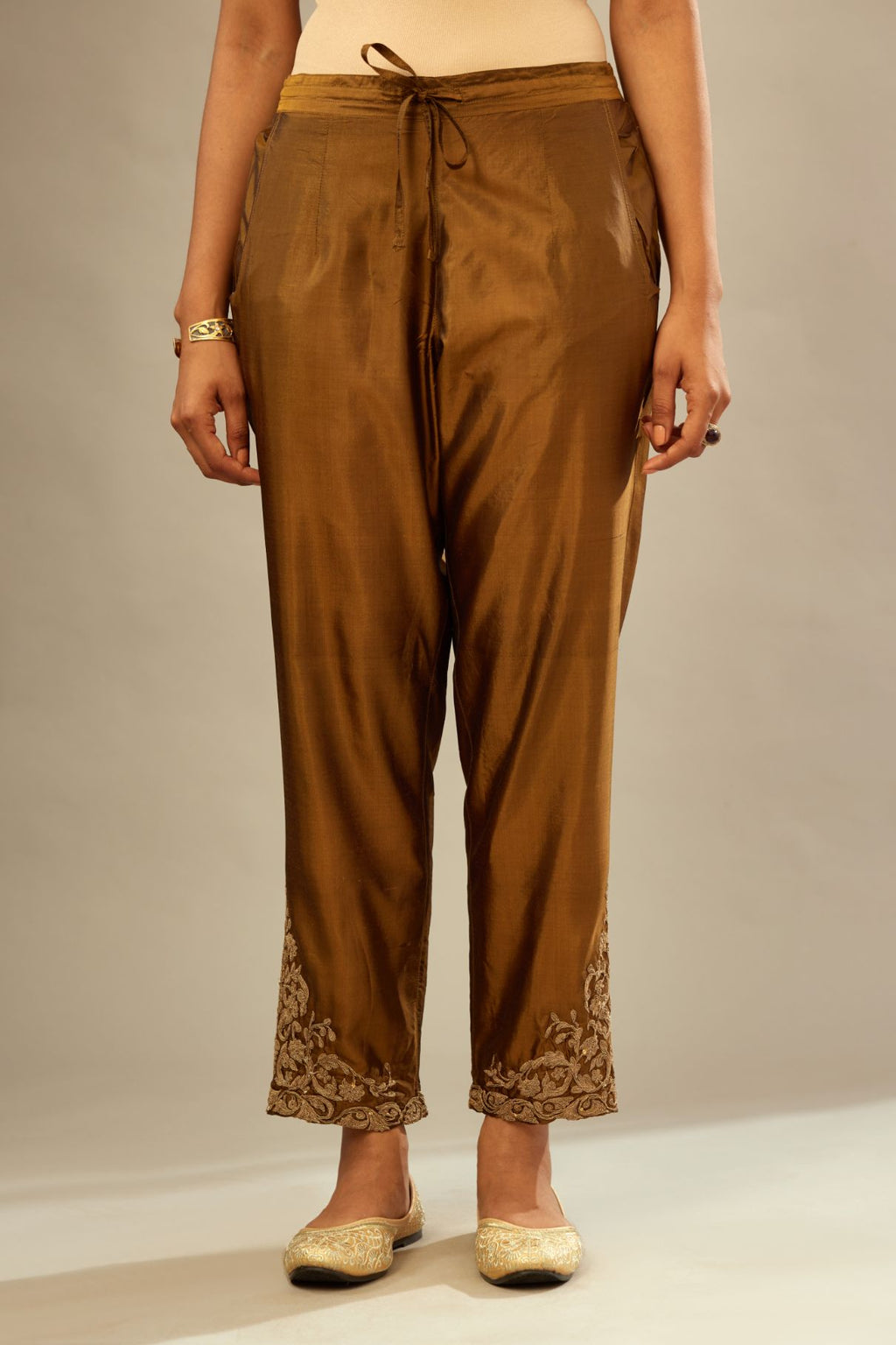 Golden olive silk pants with dori embroidered bootas at hem.