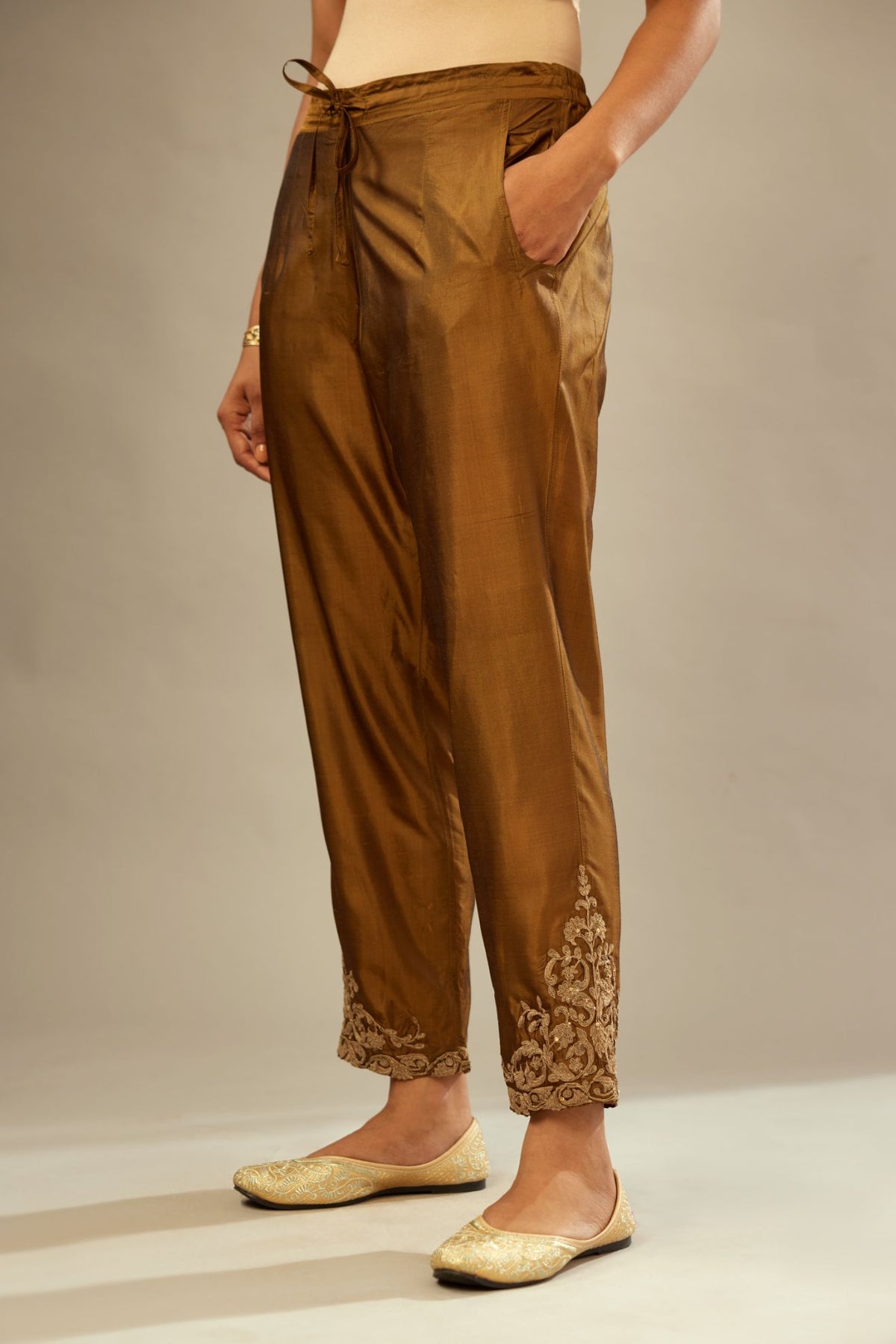 Golden olive silk pants with dori embroidered bootas at hem.