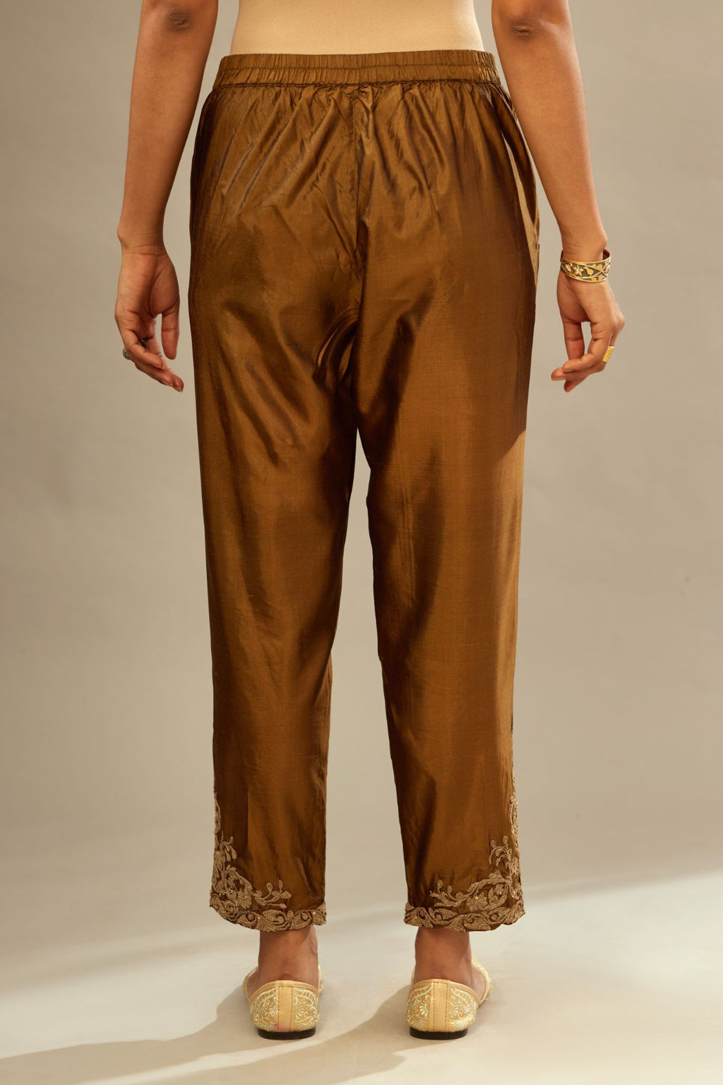 Golden olive silk pants with dori embroidered bootas at hem.