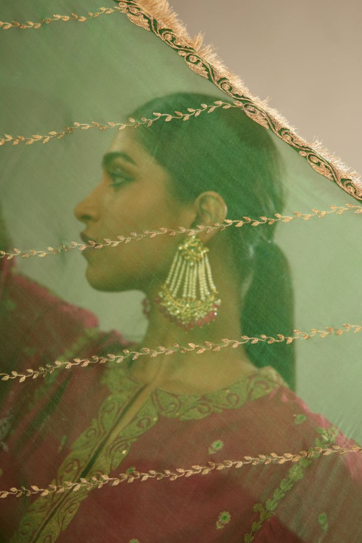 Dark green silk organza dupatta with dori embroidery border at the edges and diagonal zari embroidered lines all-over the dupatta.