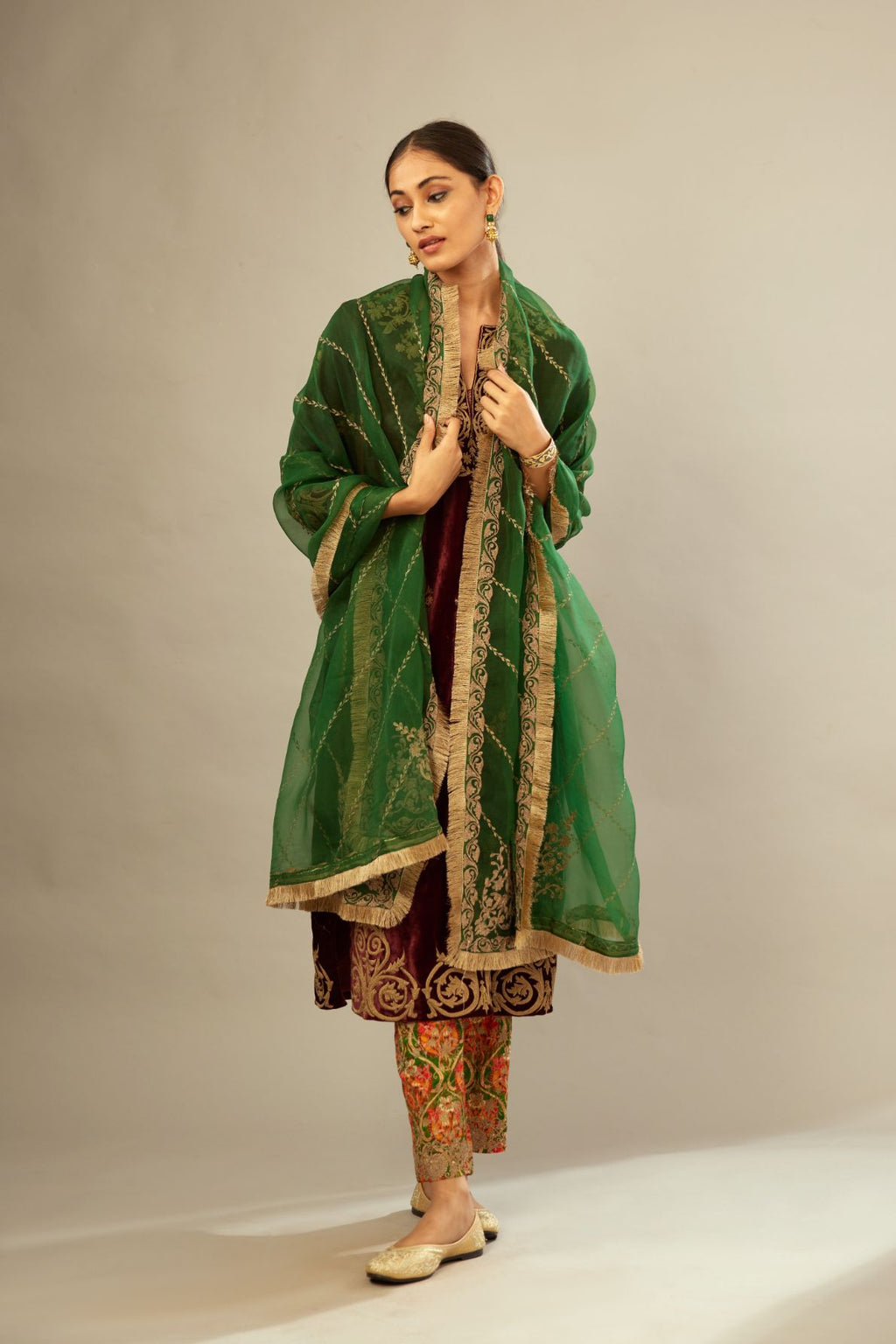 Dark green silk organza dupatta with dori embroidery border at the edges and diagonal zari embroidered lines all-over the dupatta.