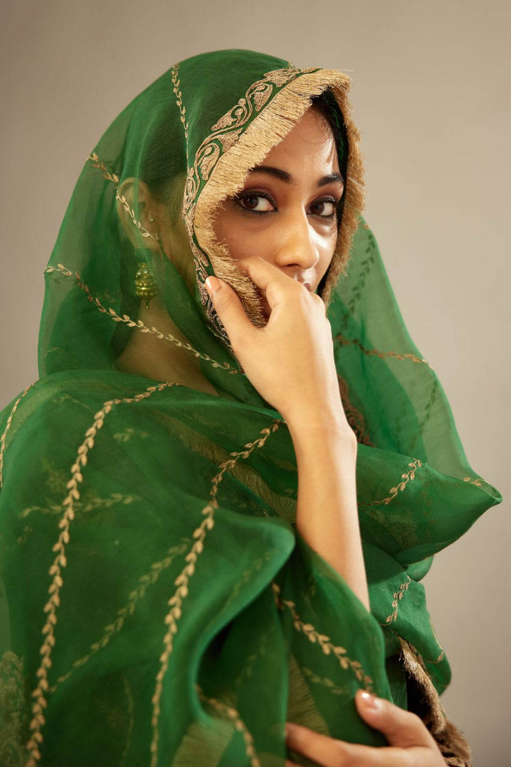 Dark green silk organza dupatta with dori embroidery border at the edges and diagonal zari embroidered lines all-over the dupatta.