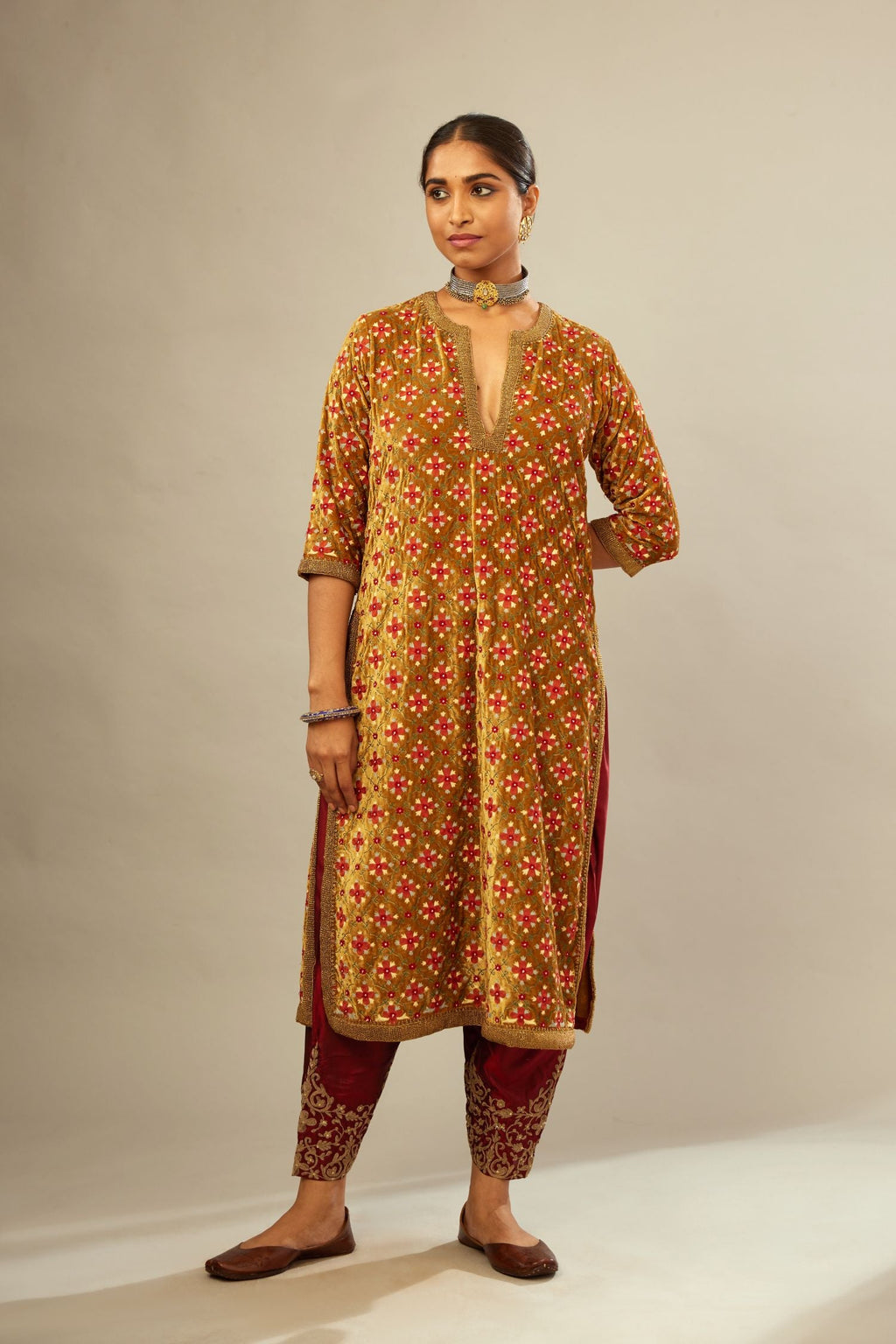 Mustard yellow silk velvet straight kurta set with full jaal silk thread embroidery. This kurta is detailed with zardosi farisha work.