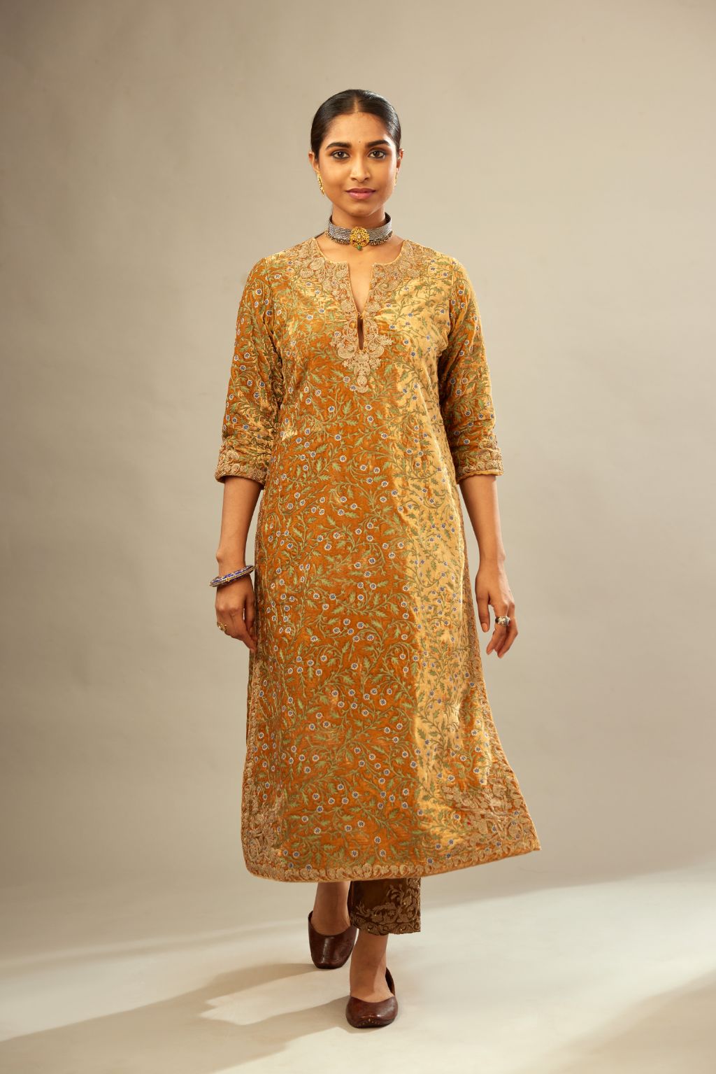 Mustard yellow silk velvet straight kurta set with delicate thread embroidery jaal all-over offset with bold gold dori embroidery at neck, sleeves and hem.
