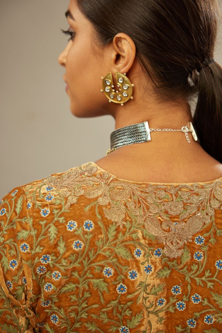 Mustard yellow silk velvet straight kurta set with delicate thread embroidery jaal all-over offset with bold gold dori embroidery at neck, sleeves and hem.