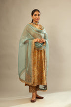 Mustard yellow silk velvet straight kurta set with delicate thread embroidery jaal all-over offset with bold gold dori embroidery at neck, sleeves and hem.