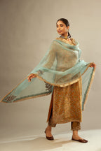 Mustard yellow silk velvet straight kurta set with delicate thread embroidery jaal all-over offset with bold gold dori embroidery at neck, sleeves and hem.