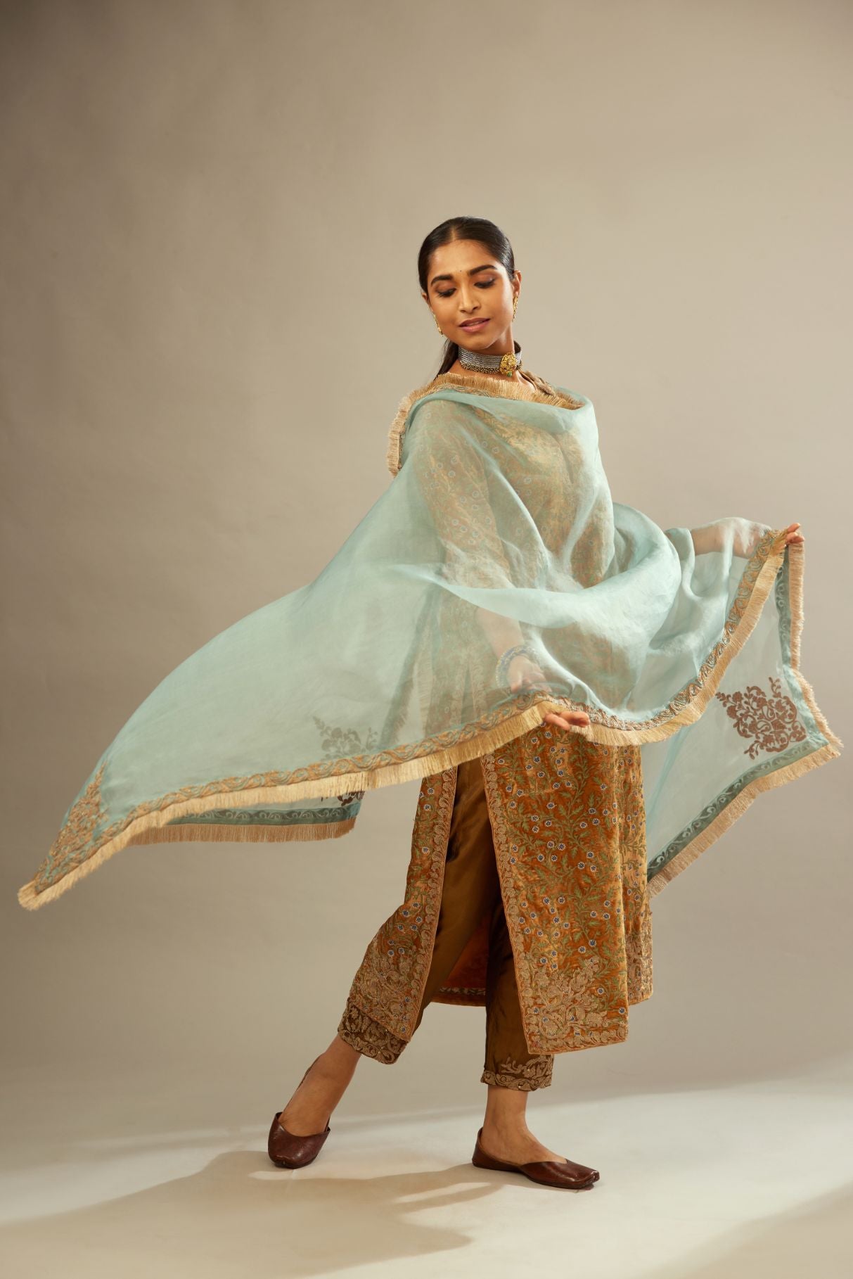Mustard yellow silk velvet straight kurta set with delicate thread embroidery jaal all-over offset with bold gold dori embroidery at neck, sleeves and hem.