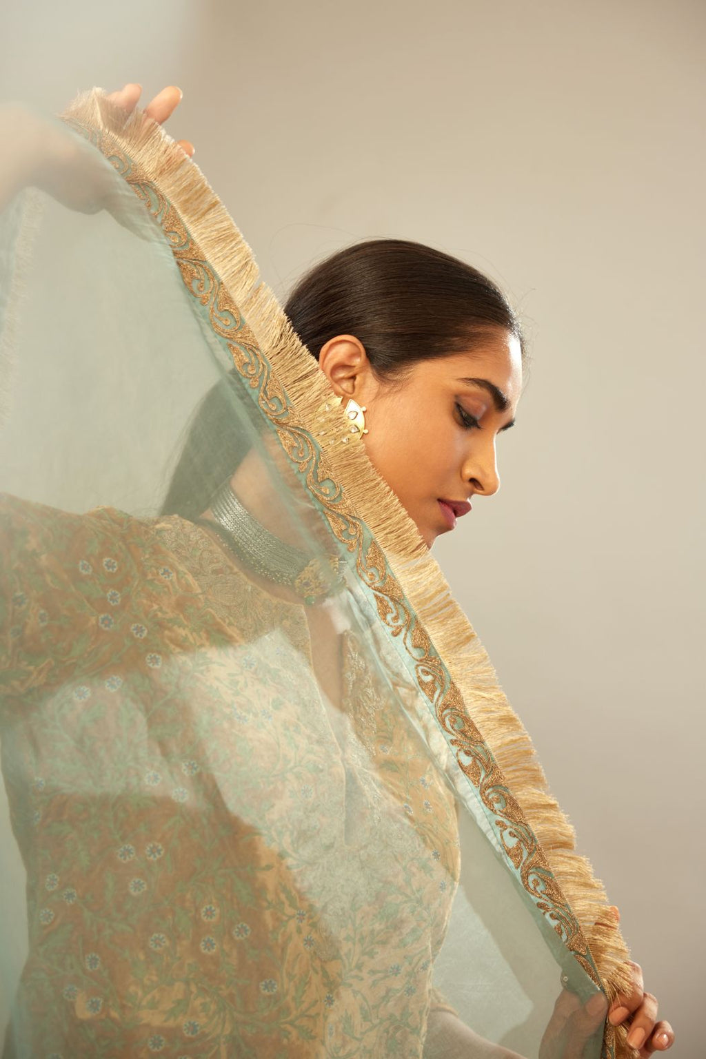 Mustard yellow silk velvet straight kurta set with delicate thread embroidery jaal all-over offset with bold gold dori embroidery at neck, sleeves and hem.