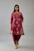Wine silk chanderi short kalidar phiran style kurta set with dori and contrast silk thread embroidery, highlighted with gold sequins work.