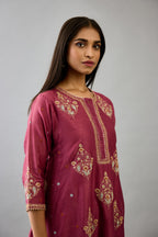Wine silk chanderi short kalidar phiran style kurta set with dori and contrast silk thread embroidery, highlighted with gold sequins work.