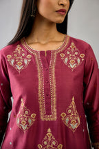 Wine silk chanderi short kalidar phiran style kurta set with dori and contrast silk thread embroidery, highlighted with gold sequins work.