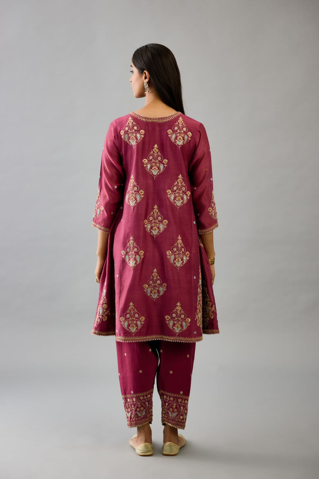 Wine silk chanderi short kalidar phiran style kurta set with dori and contrast silk thread embroidery, highlighted with gold sequins work.