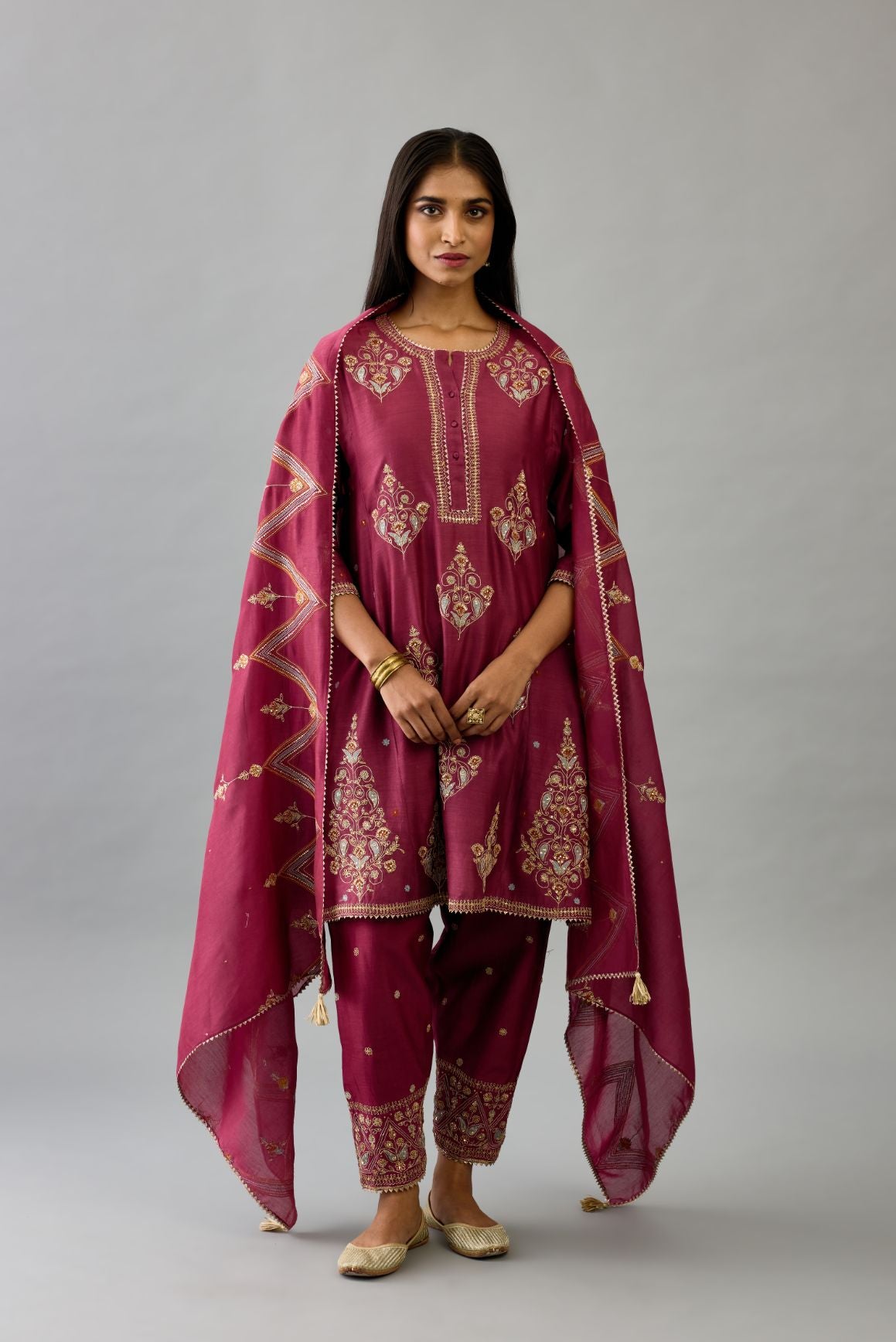 Wine silk chanderi short kalidar phiran style kurta set with dori and contrast silk thread embroidery, highlighted with gold sequins work.