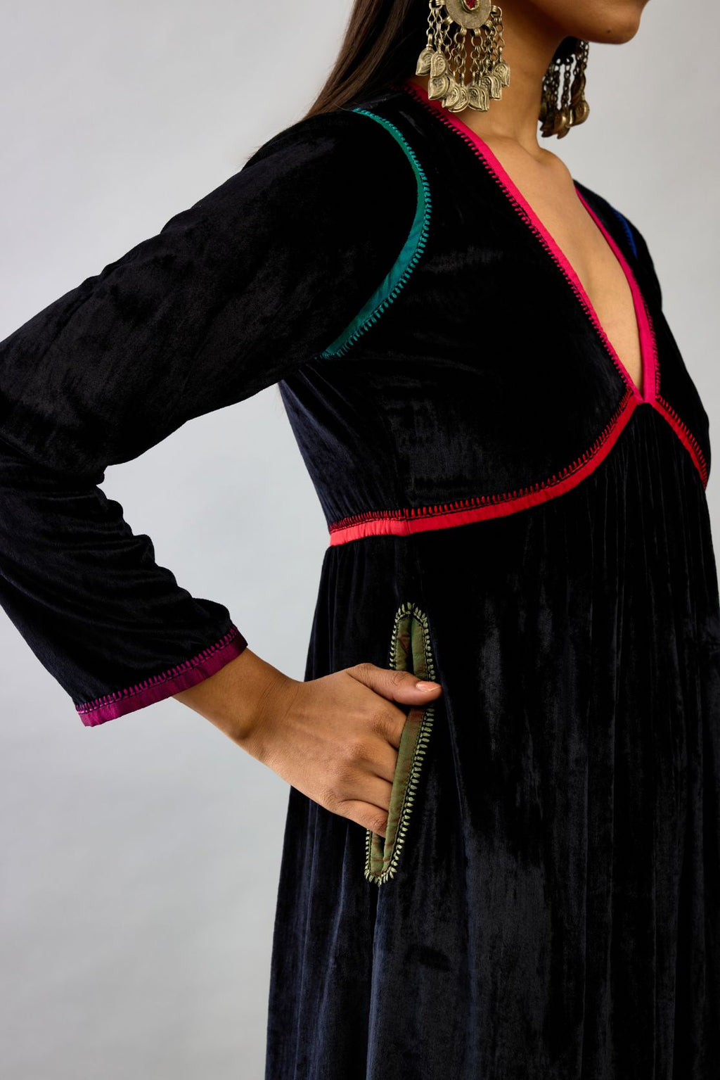 Black silk velvet kurta dress set with multi colored silk facing and embroidery details.