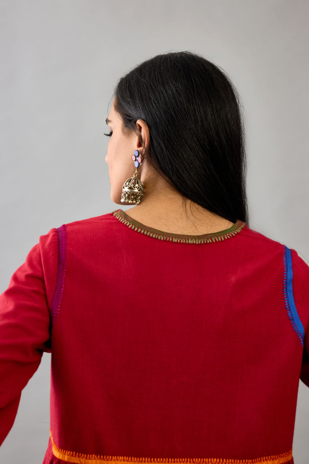 Red Handloom Cotton kurta set dress with multi colored silk facing and embroidery details.