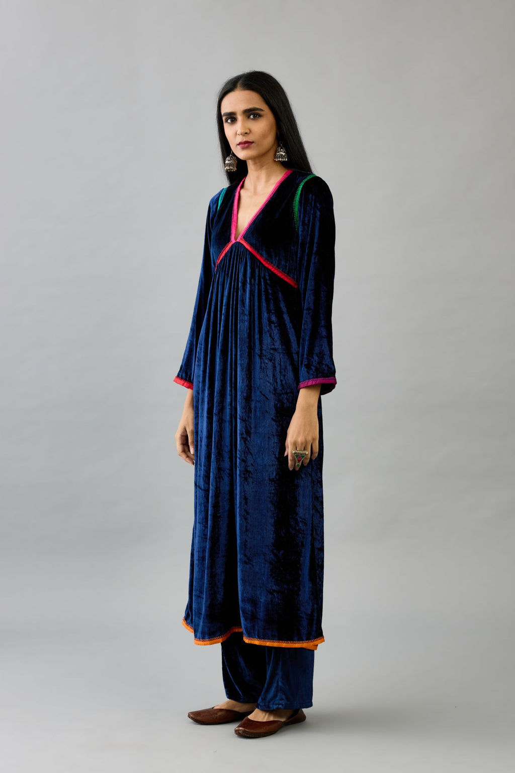 Blue silk velvet kurta dress set with multi colored silk facing and embroidery details.